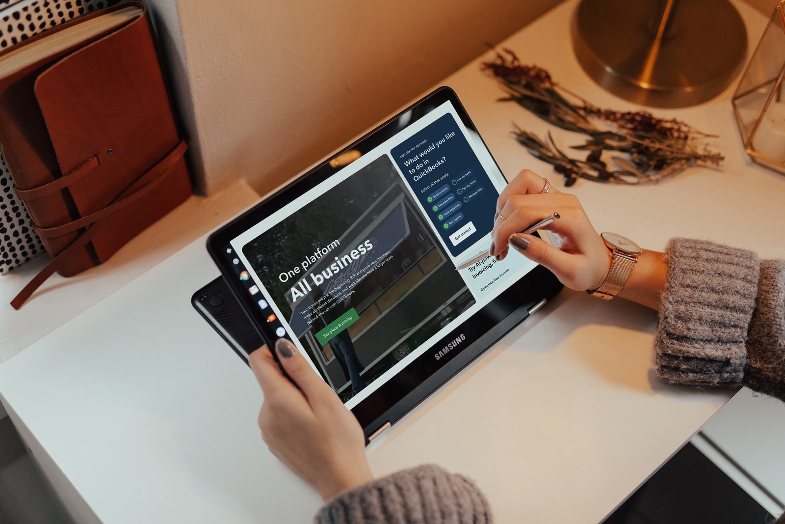 QuickBooks landing experience shown on a tablet on a desk